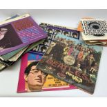 A selection of assorted vinyl records and singles, to include The Beatles Sgt Peppers Lonely Hearts