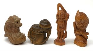 Four carved wooden Japanese netsukes, modelled as a dragon, two snails upon a log, a bird perched up