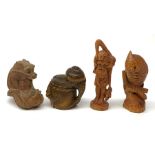 Four carved wooden Japanese netsukes, modelled as a dragon, two snails upon a log, a bird perched up