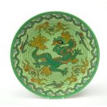 A Charlotte Rhead for Crown Ducal pattern pottery plate, decorated with a green dragon, with printed