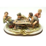 Large Capodimonte figure group 'The Card Cheat', modelled as four card players, signed Merli, raised