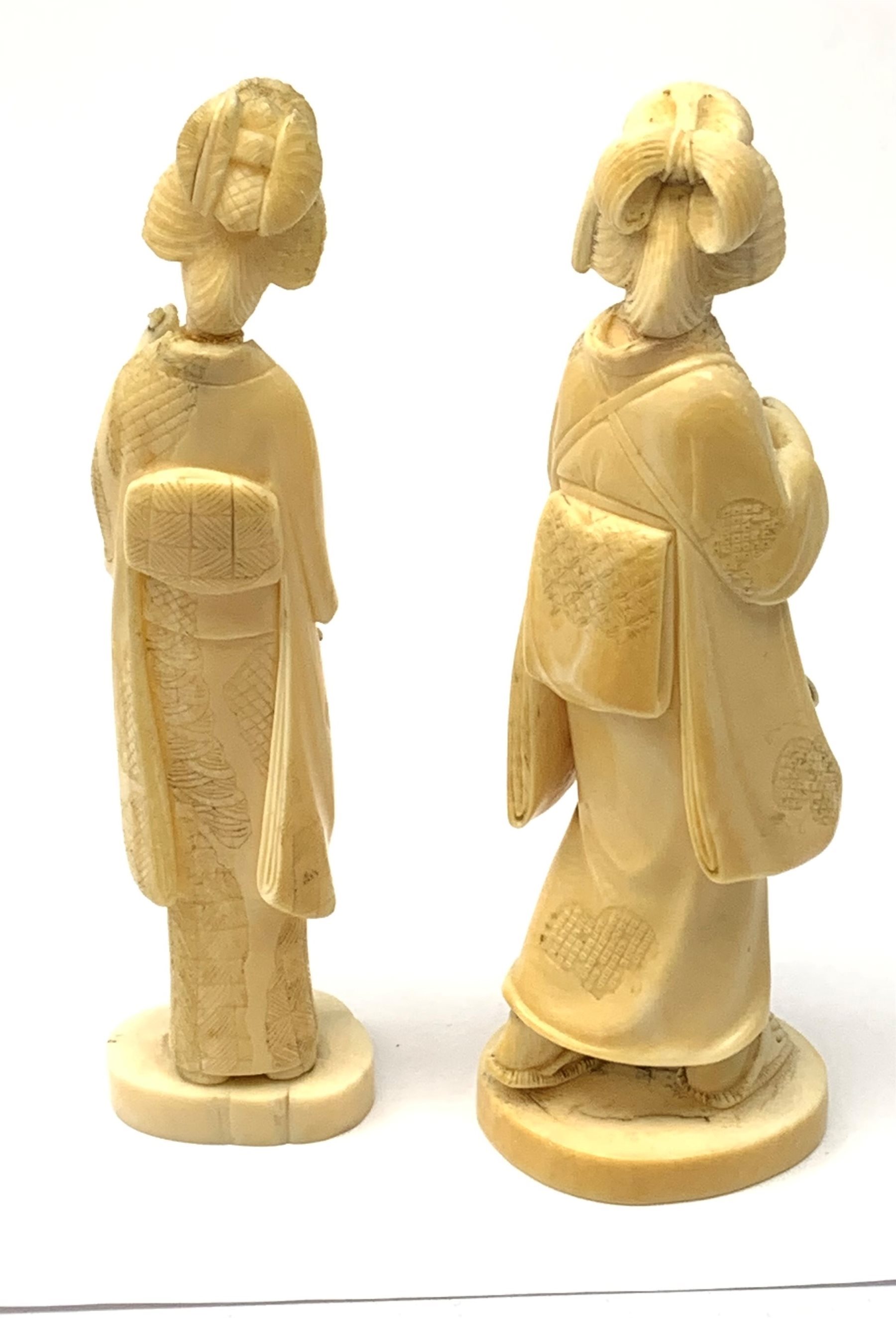 Two Japanese carved ivory okimons, each modelled as a geisha, each approximately H15cm. - Image 2 of 3