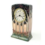 A Moorcroft mantle clock, decorated in the Cluny pattern designed by Sally Tuffin, with impressed an