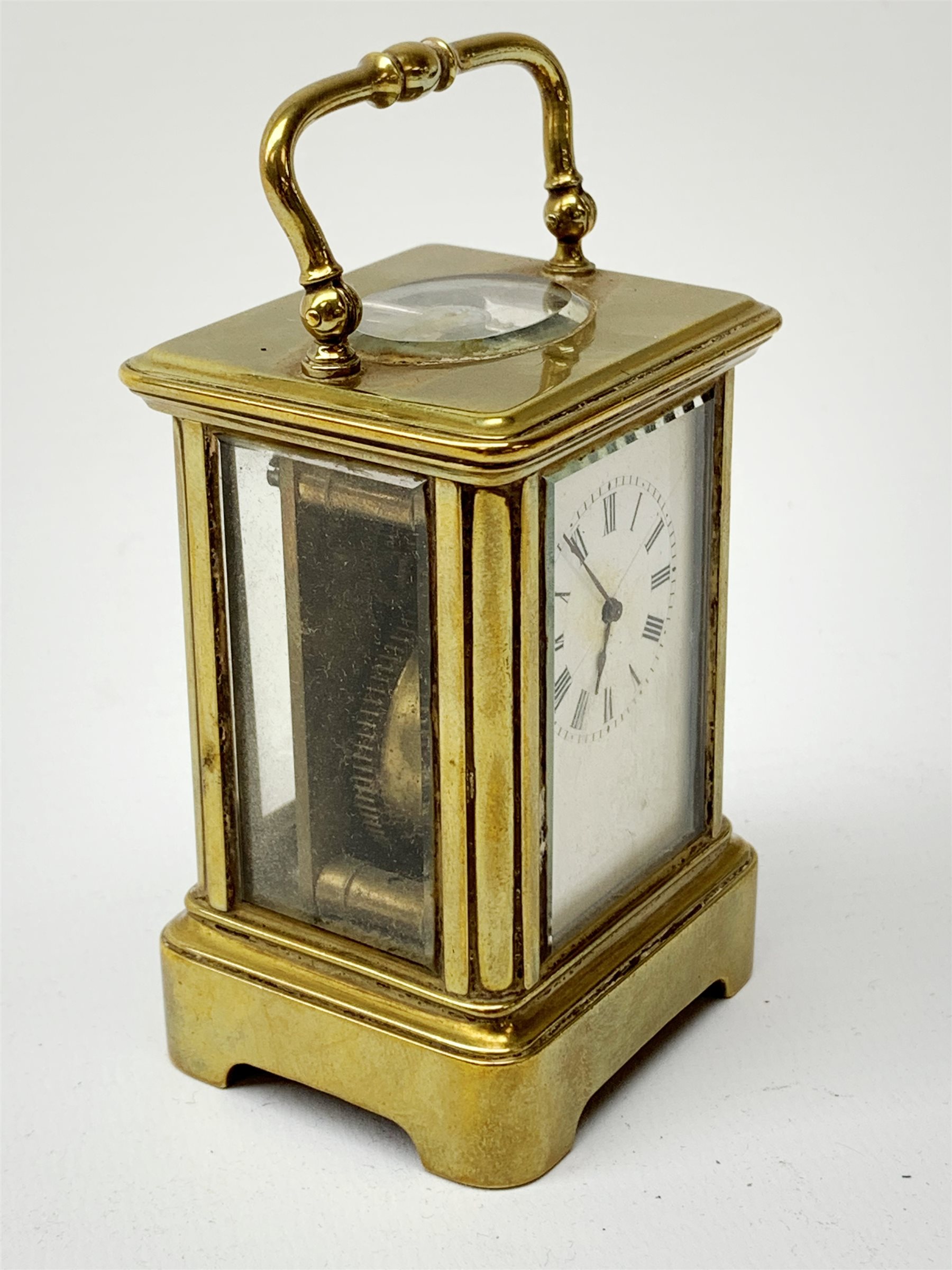 A brass cased miniature carriage clock, the white enamel dial with black Roman numerals, H7cm. - Image 2 of 7