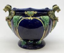 A 19th Century majolica blue ground jardini�re, with twin dragon handles, H26cm.