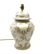 An India Jane ceramic table lamp, of baluster form, the white ground detailed with foliate and figur
