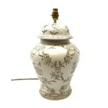 An India Jane ceramic table lamp, of baluster form, the white ground detailed with foliate and figur