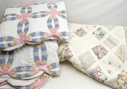 A Vintage style patchwork double quilt or bed spread, together with two single examples.