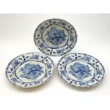 Three 19th century blue and white Delft plates, each with floral decoration, D30.5cm.