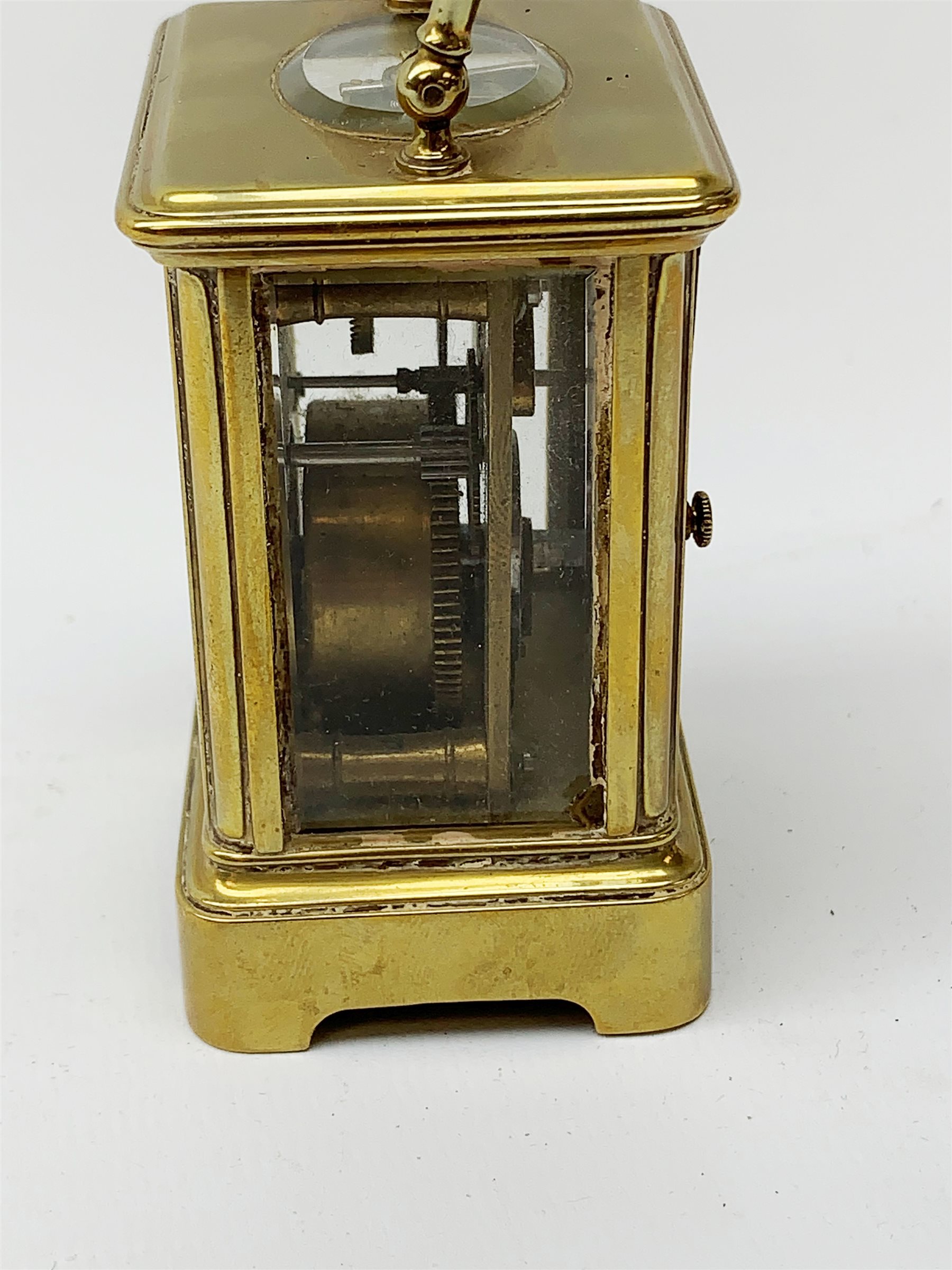 A brass cased miniature carriage clock, the white enamel dial with black Roman numerals, H7cm. - Image 5 of 7