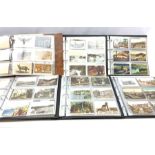 Six modern loose leaf albums containing over one thousand Edwardian and later postcards including re