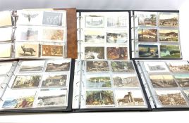 Six modern loose leaf albums containing over one thousand Edwardian and later postcards including re