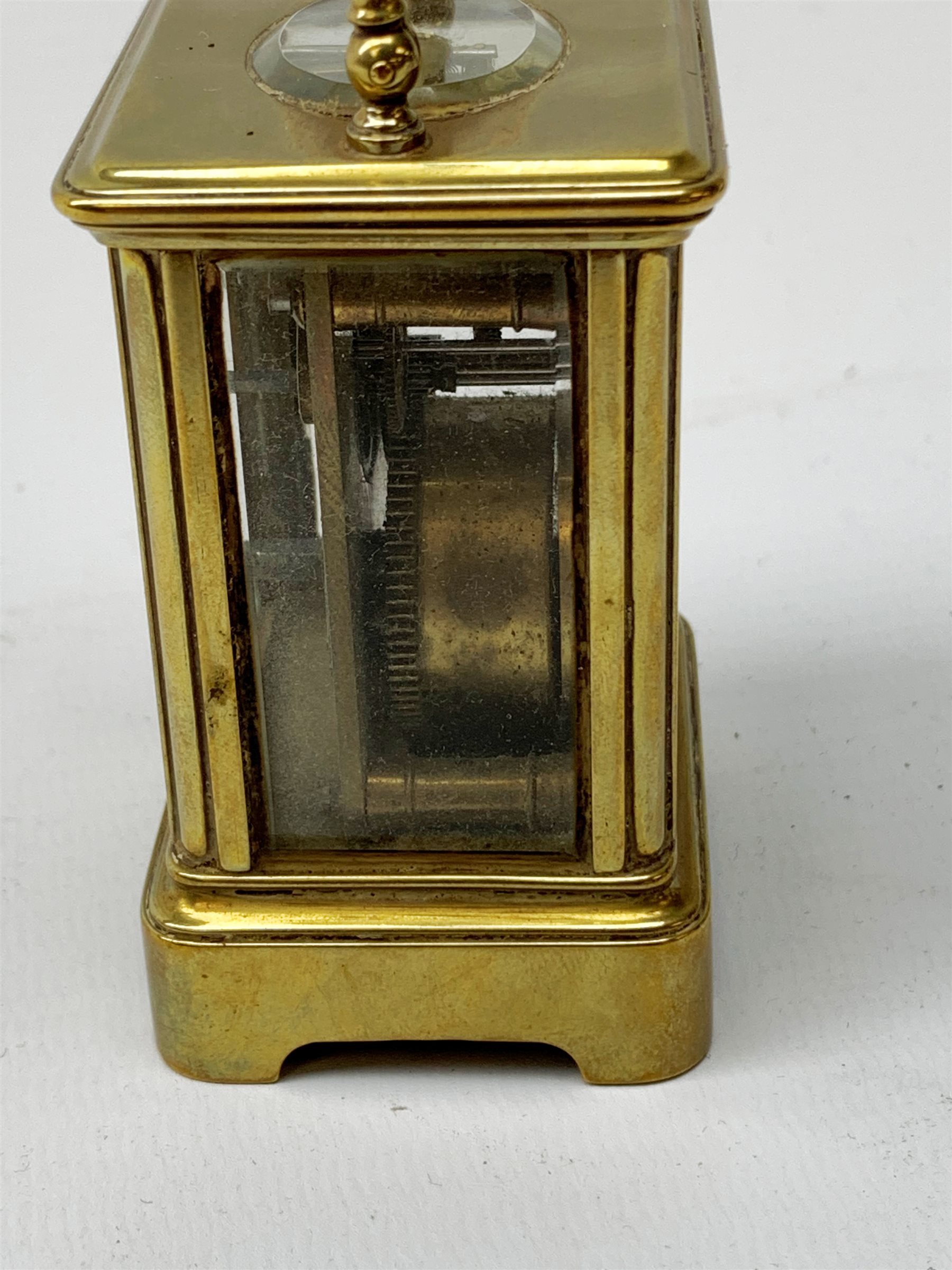 A brass cased miniature carriage clock, the white enamel dial with black Roman numerals, H7cm. - Image 6 of 7