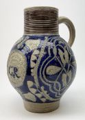 An 18th century Westerwald stoneware flagon, the bulbous body with moulded GR Royal cypher beneath a