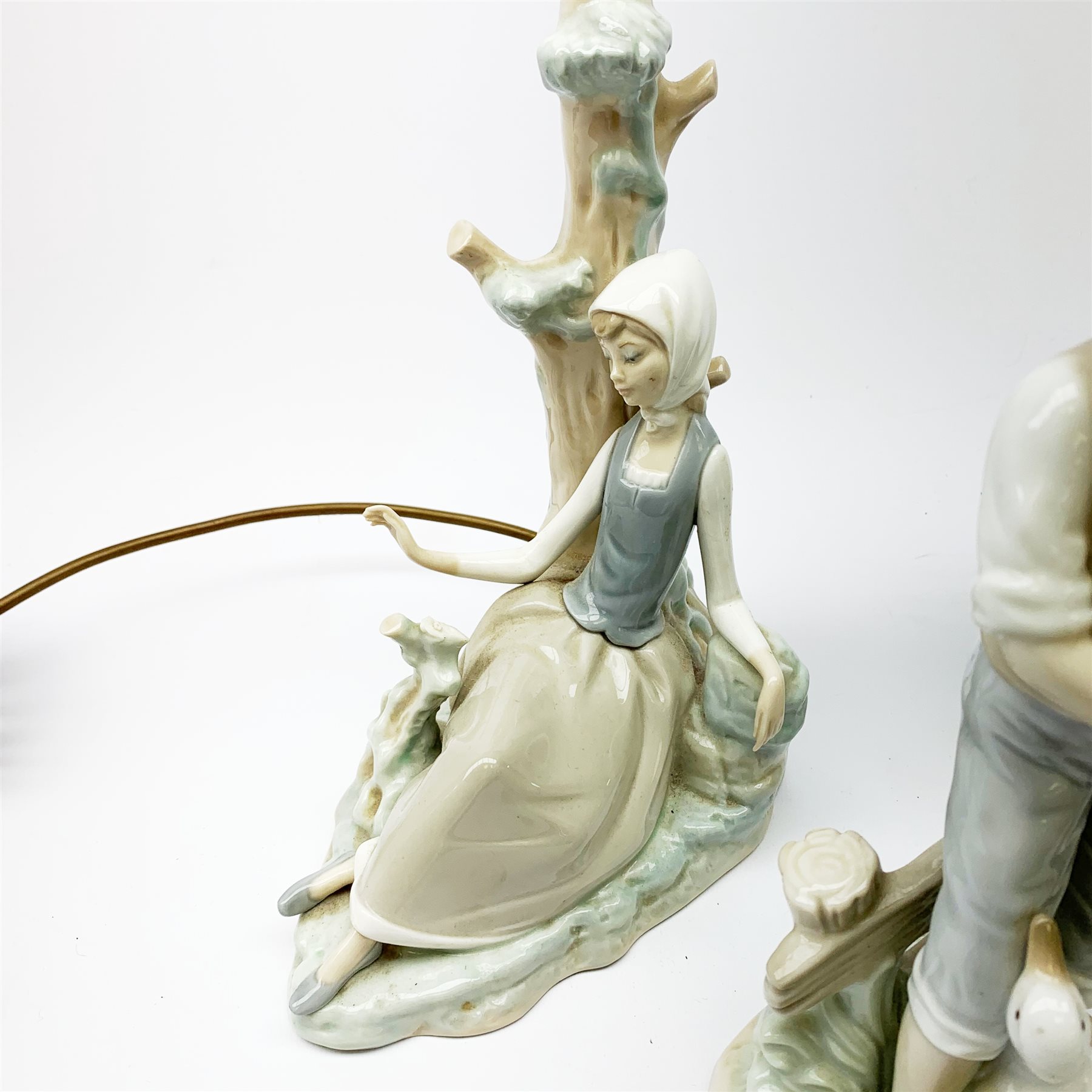A group of figurines, to include a large Nao example, H32.5cm, and a Lladro table lamp, (a/f). - Image 2 of 4