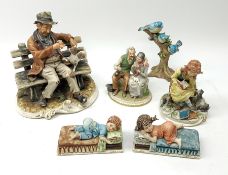A selection of Capodimonte figures, comprising a large figure group modelled as a tramp on a bench w