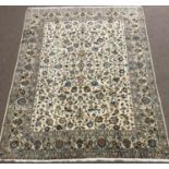 Large Kashan ivory ground rug, repeating border, blue trailing foliage, central medallion, 405cm x 3