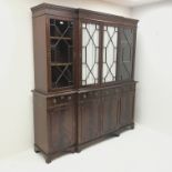 Georgian style mahogany breakfront bookcase, projecting cornice, dentil frieze, four doors above fou