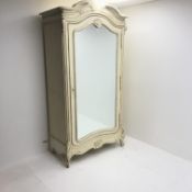 Large French style wardrobe, arched top with pediment, single mirrored door enclosing hanging rail a