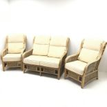 Two seat cane and bamboo conservatory sofa, cushions upholstered in pale gold (W122cm) and pair matc