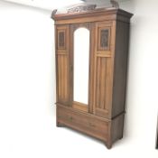 Late Victorian mahogany wardrobe, carved pediment, projecting cornice, single mirrored door above si