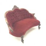 Victorian mahogany framed sofa, arched back with floral carved cresting rail, scrolling arms, acanth