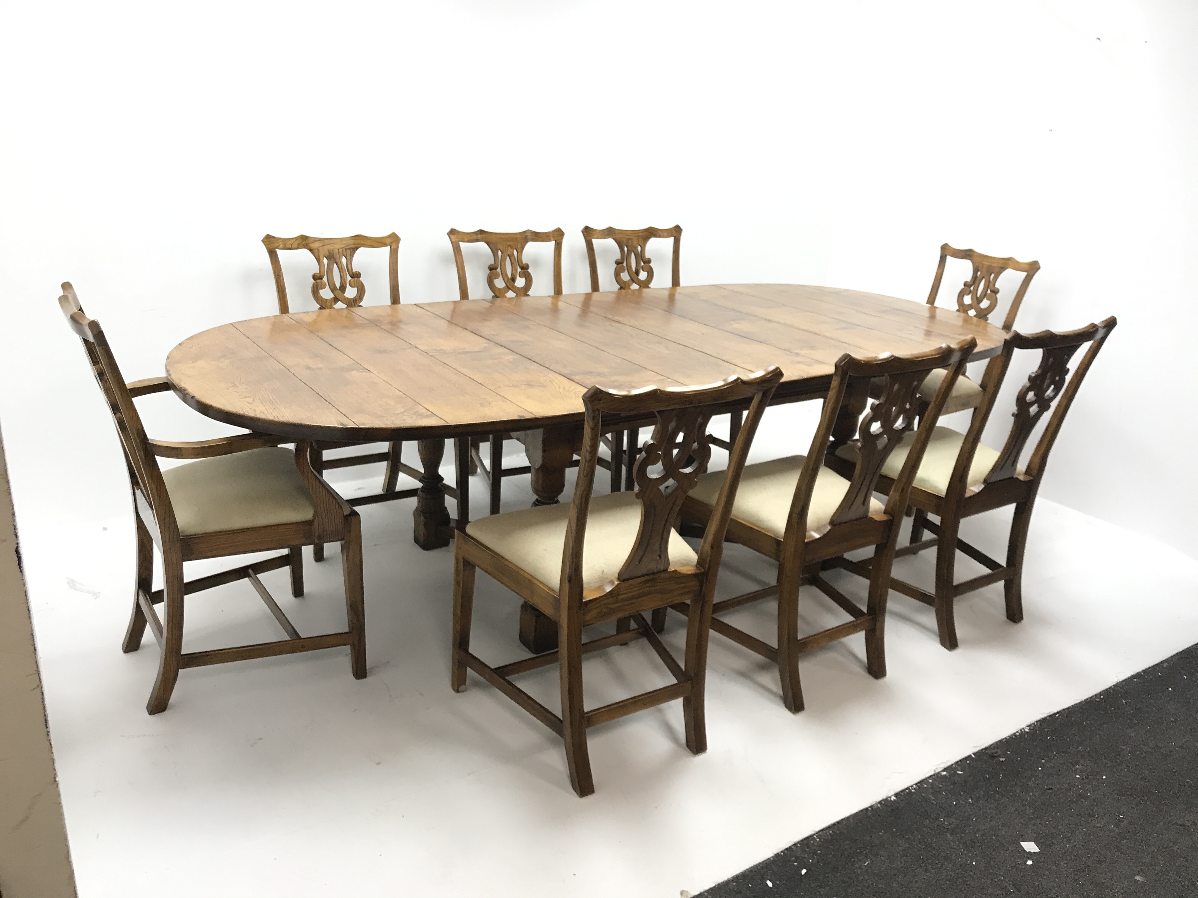 19th century style extending oak dining table, two leaves, baluster supports joined by shaped stretc