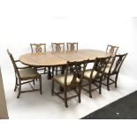 19th century style extending oak dining table, two leaves, baluster supports joined by shaped stretc