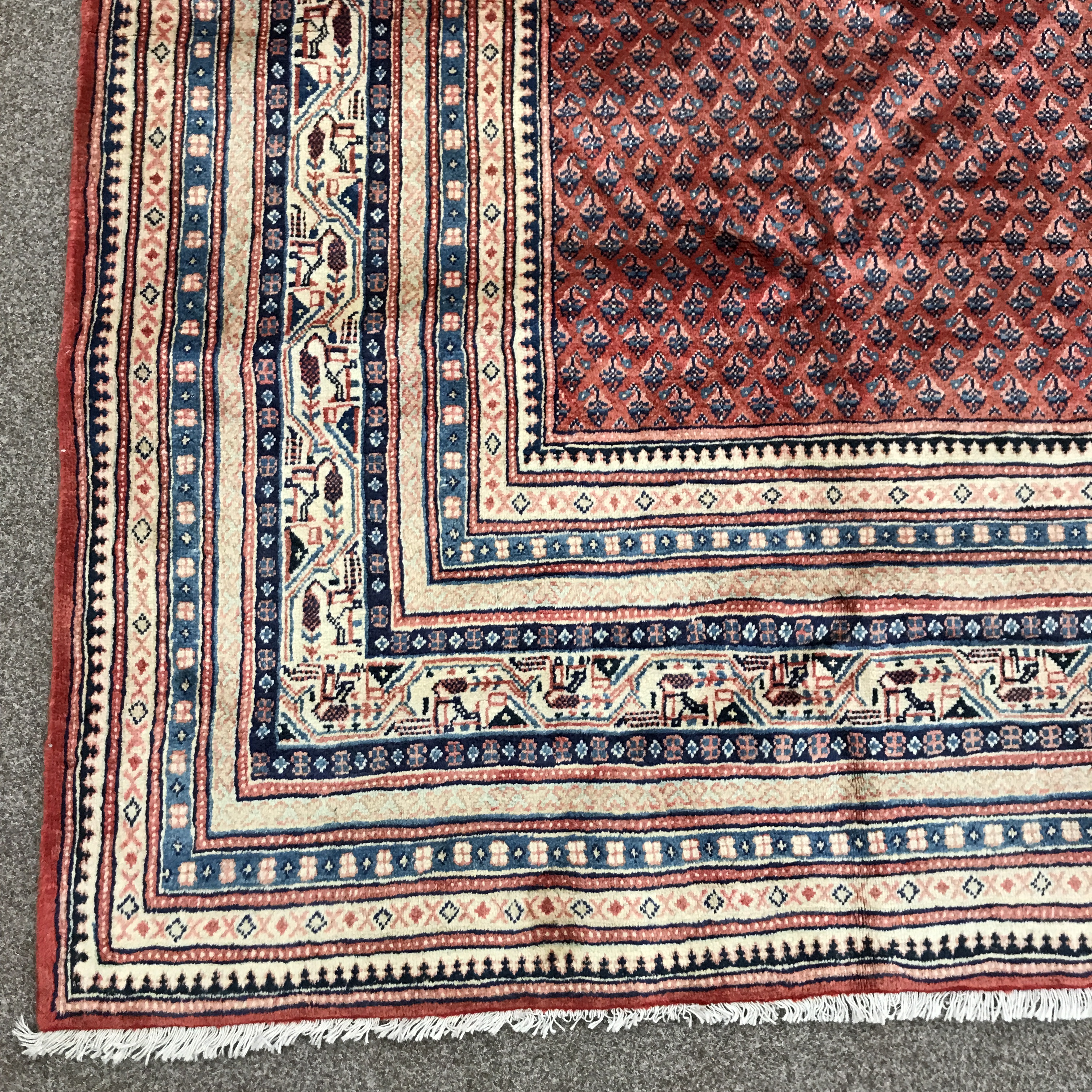 Large Persian Araak red ground rug, multiple band border, repeating boteh motifs field, 392cm x 284c - Image 7 of 8