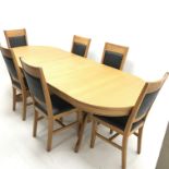Oval solid oak extending dining table, two turned columns on shaped supports joined by stretcher (W