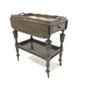 Early 20th century oak tea trolley, carved cup and cover supports joined by solid undertier, W76cm,