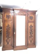 Edwardian walnut breakfront triple wardrobe, centre bevelled mirror door enclosing birds eye maple s