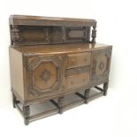 Early 20th century oak sideboard, raised back with carved cup and cover supports above three drawers