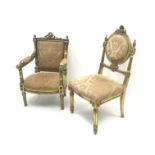 Gilt wood framed heavily carved armchair, upholstered in pale gold fabric with floral pattern, turne