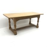Light oak refectory style dining table, baluster supports joined by floor stretchers, W184cm, H77cm,
