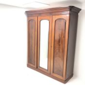 Victorian mahogany triple wardrobe, projecting cornice above single mirrored door flanked by two oth