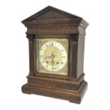 Late 19th century walnut architectural cased bracket clock, square brass dial with silvered Roman ch