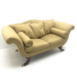 Regency style two seat settee, shaped cresting rail, scrolling arms, reeded outsplayed brass capped
