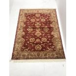 Persian red ground rug, central medallion, 187cm x 140cm
