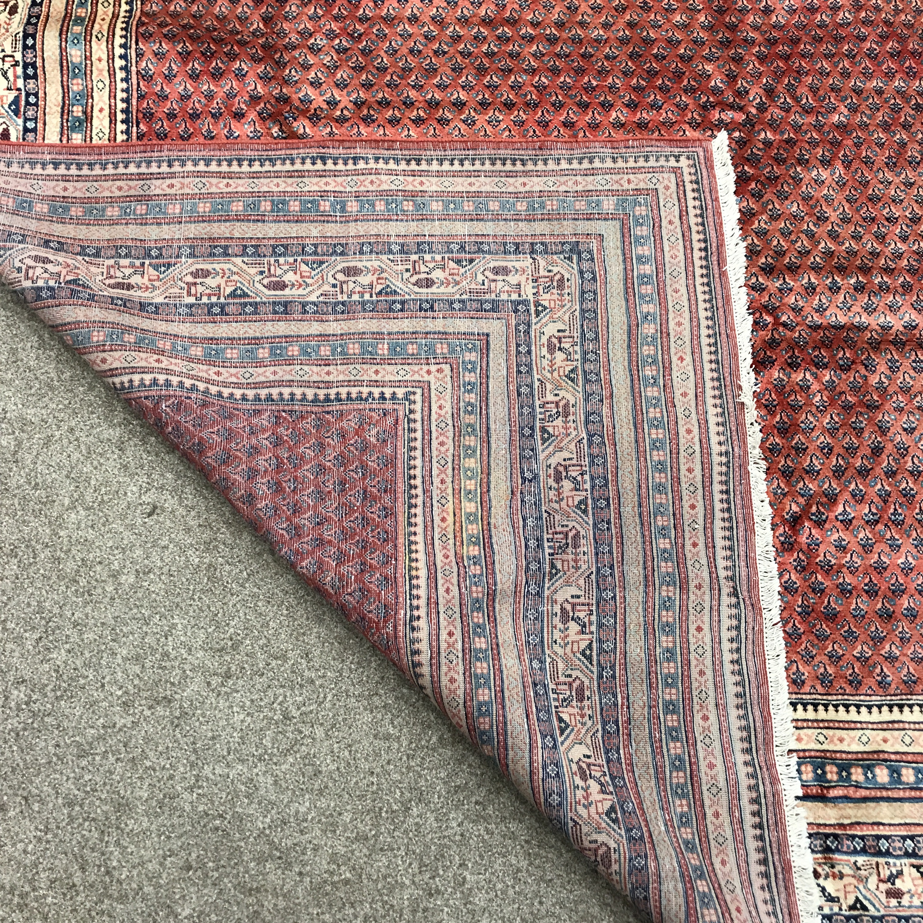 Large Persian Araak red ground rug, multiple band border, repeating boteh motifs field, 392cm x 284c - Image 8 of 8