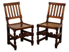Pair of country made late 17th/18th century oak chairs, moulded slat backs and solid seats on turned