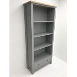 Next Malvern grey and oak finish open bookcase, three shelves above two drawers, stile supports, W84