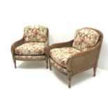 Pair late 20th century walnut framed double cane Bergere armchairs, upholstered in a beige ground fl