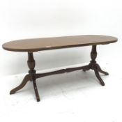 Regency style mahogany coffee table, two turned supports joined by single stretcher on shaped feet,