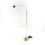 Brass floor standing reading lamp with adjustable head