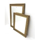 Pair graduating reeded gilt framed bevel edge mirrors, W76cm, H107cm max