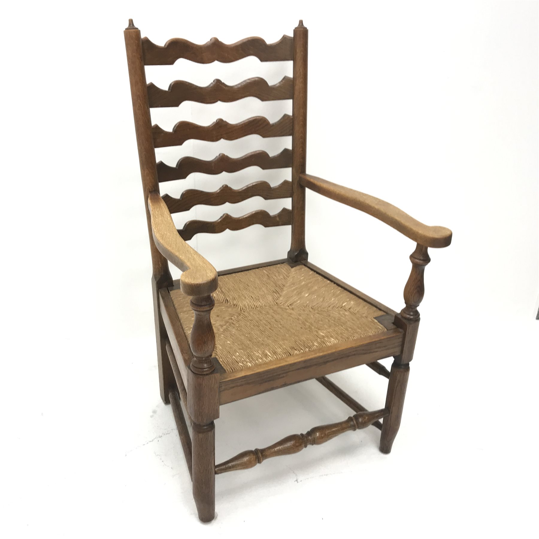 Early 20th century oak fireside armchair, shaped ladder back, reeded drop in seat, turned supports j - Image 4 of 6