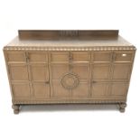 E. Gomme Ltd of High Wycombe oak sideboard, raised carved back, moulded top, three drawers above two