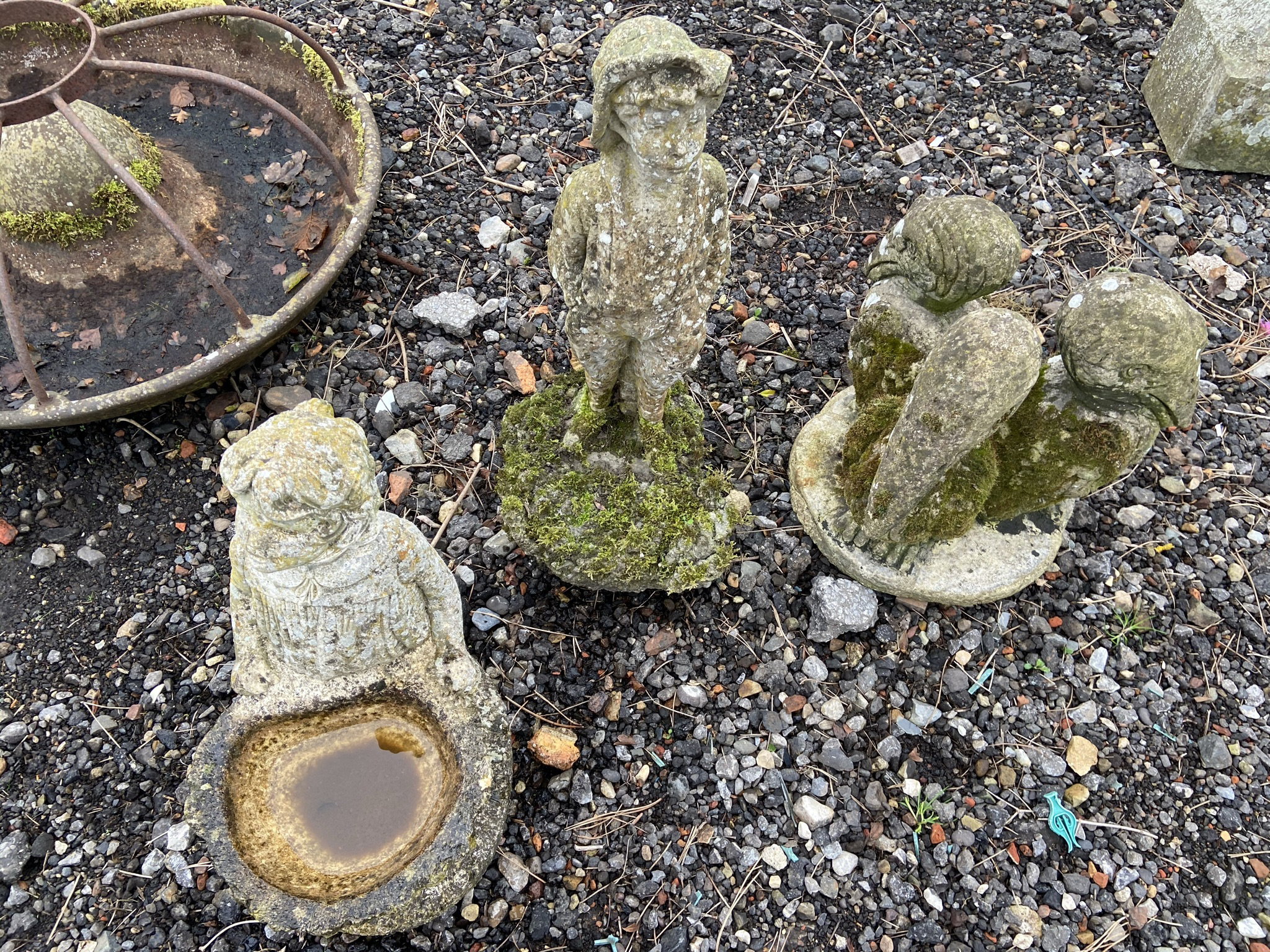 Three composite stone garden figures