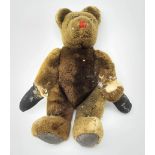 Mid-20th century plush covered teddy bear, the revolving head with applied eyes and stitched nose an